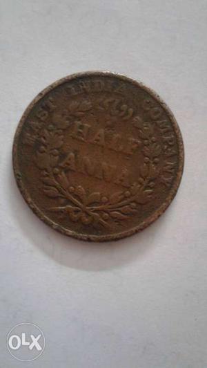 Round Copper-colored Half Anna India Coin