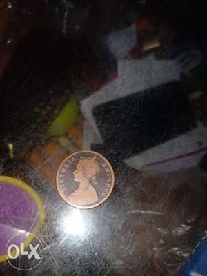 Round Copper-colored Victoria Empress Coin