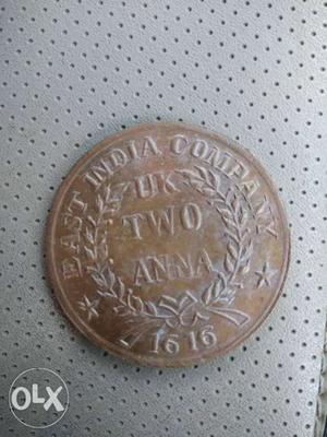Round  Gold-colored UK Two Anna Coin