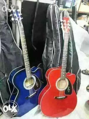 Two Blue And Red Cutaway Acoustic Guitars