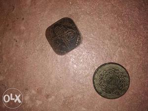 Two Gold-colored Indian Paise Coins