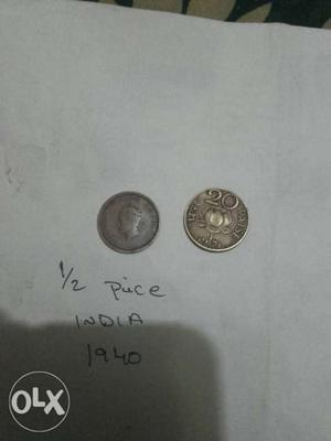 Two Round Silver-colored Half Indian Paise Coins