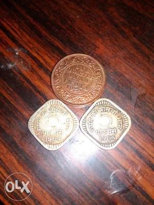 Two Silver And One Copper-colored Coins
