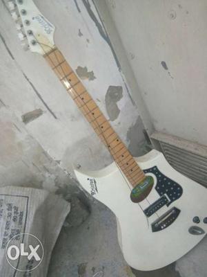 White And Brown Electric Guitar