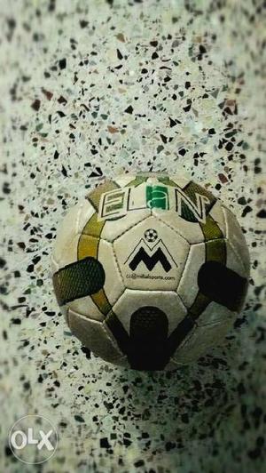White, Red, And Black Soccer Ball