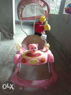 Baby's Pink And Multicolored Push Walker