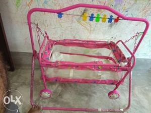 Baby's Pink And White Metal Cradle