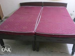 Brown Wooden Twin Bed Frame And Red Twin Mattress