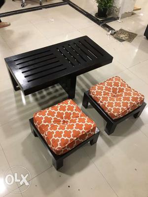 Rectangular Black Wooden Table And Orange Chairs