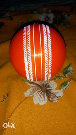 Red And Gray Cricket Ball