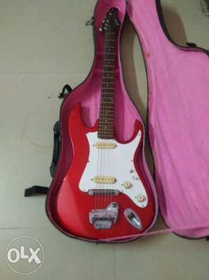 Red And White Stratocaster Electric Guitar And Pink Case