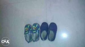 Two Pairs Of Black And Blue Shoes