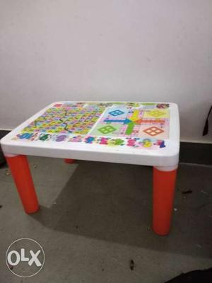 White, Red, And Yellow Wooden Table