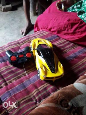 Yellow And Black RC Toy Car And Black Radio Controller