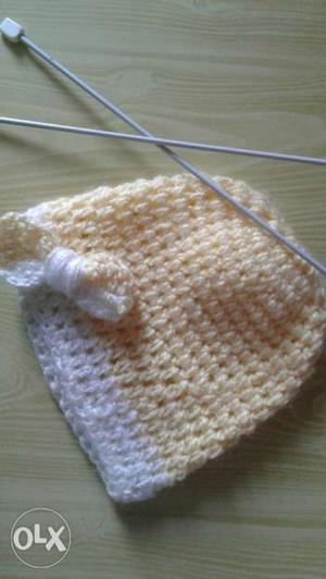 Yellow and white knitted cap