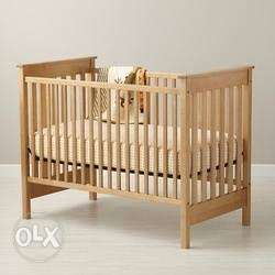 Baby cradle on teak wood.