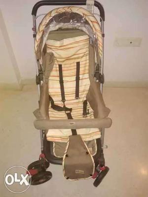 Baby's Gray And Brown Stroller