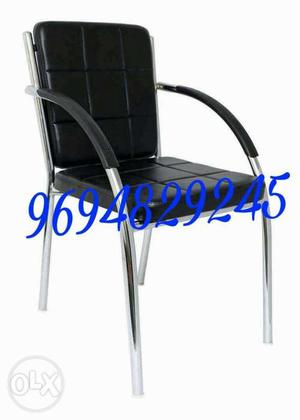 Black Padded Armchair With Silver Frame With Text Overlay