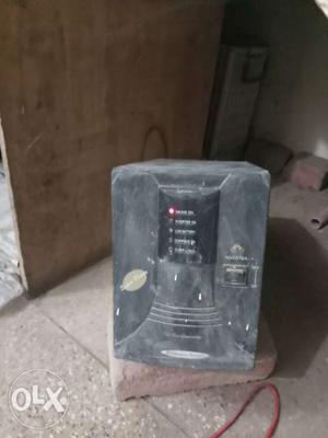 Black inverter with battery and stand