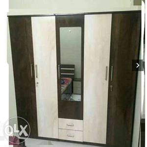 Brown And White Wooden Wardrobe With Mirror