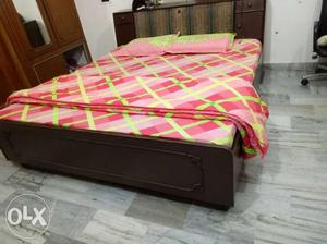 Double bed with boxes and mattresses