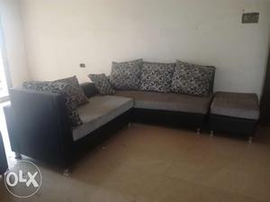 L shaped sofa with pillows