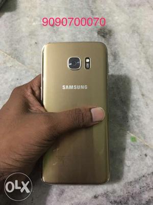 1 year old Samsung s7 edge gold. Price fix fix