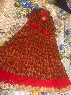 Long Lovely Red coloured kurti with expensive kundans