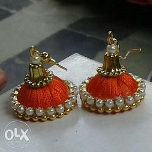 Pair Of Gold-colored Earrings With White Gemstones