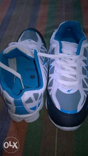 Pair Of White #10size-and-blue Basketball Shoes