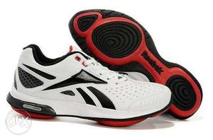 Pair Of White-and-black Reebok easytone shoes wore 2 or 3