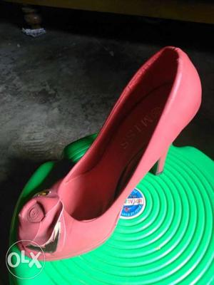 Paired Red Heeled Shoe