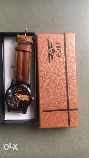 Round Black Chronograph Watch With Brown Strap And Box
