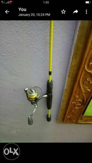 Black And Yellow Fishing Rod With Fishing Reel Screenshot