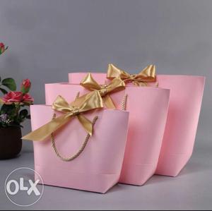 Gift paper bags in three different sizes and colors