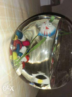 It is a fish pot with two plastic fish's and its