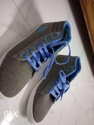 Pair Of Gray-and-blue Sneakers size - 11