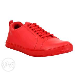 Red coloured fancy shoes. Ek bhi baar nahi pehne.