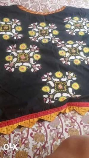 Black, Yellow, And Green Floral Textile