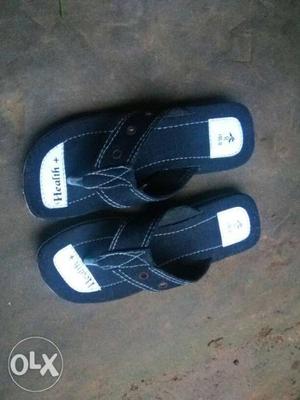 Pair Of Black-and-white Nike Slide Sandals