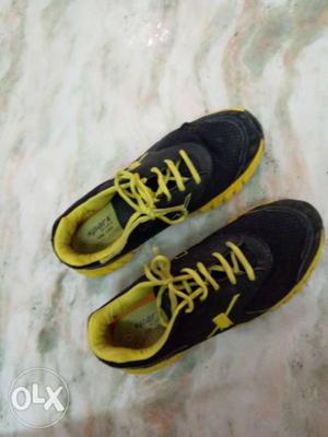 Pair Of Black-and-yellow sparx Running Shoes
