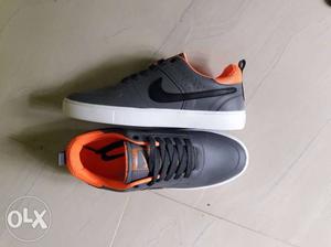 Pair Of Gray-and-orange Nike Sneakers