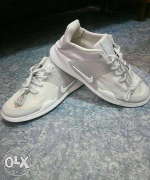 Pair Of White Nike Low-top Sneakers