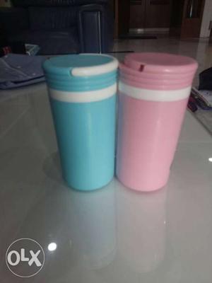 Two Blue And Pink Plastic Containers
