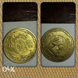 One Round Gold -colored Coin
