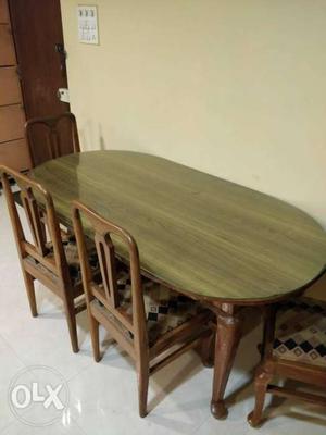 Oval Brown Wooden Dining Table With Four Chairs Set urgent