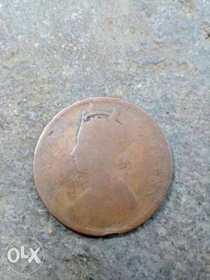Profile Embossed Round Copper-colored Coin