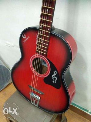 Red acoustic gomiczom guitar on low price