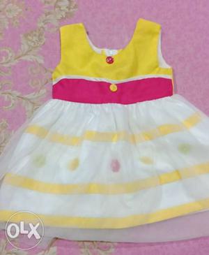 Beautiful yellow and white soft netted frock..for 1 year