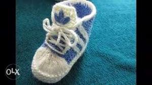 Pair Of White-and-blue Knitted Shoes